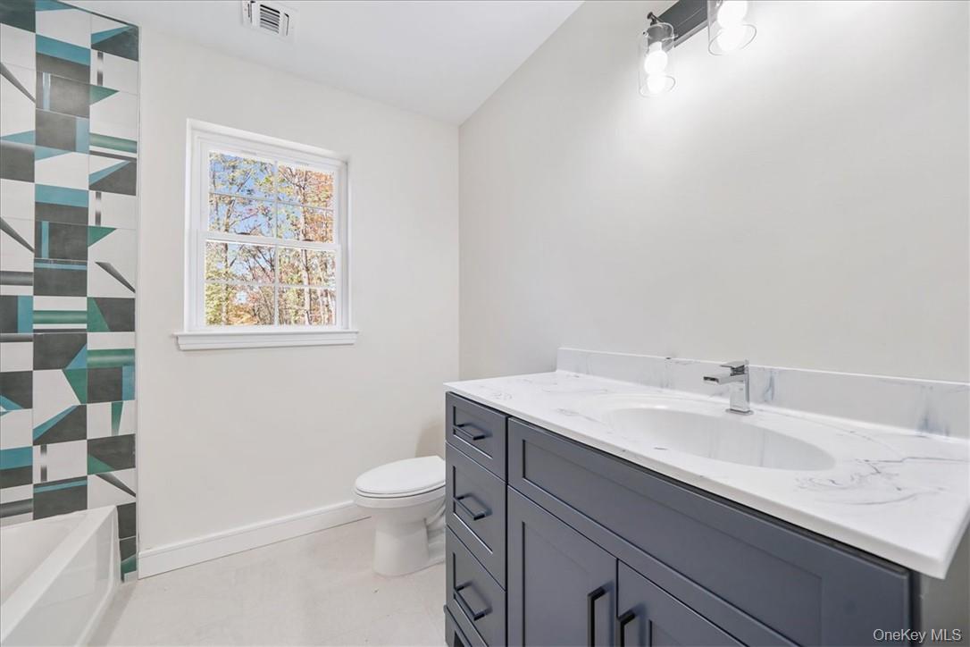 Lot 3-62 Camp Monroe Road Monroe, NY 10950 - Photo 28 of 39 Bathroom with a shower, vaulted ceiling, vanity, and toilet