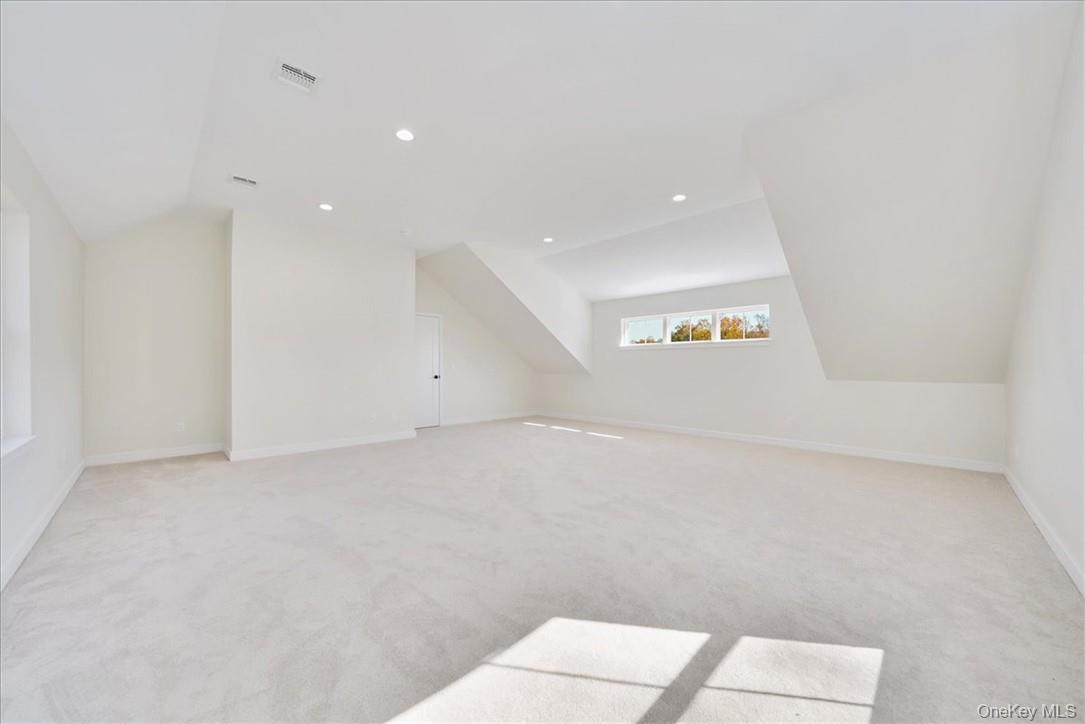 Lot 3-62 Camp Monroe Road Monroe, NY 10950 - Photo 32 of 39 Bonus room with light carpet and vaulted ceiling