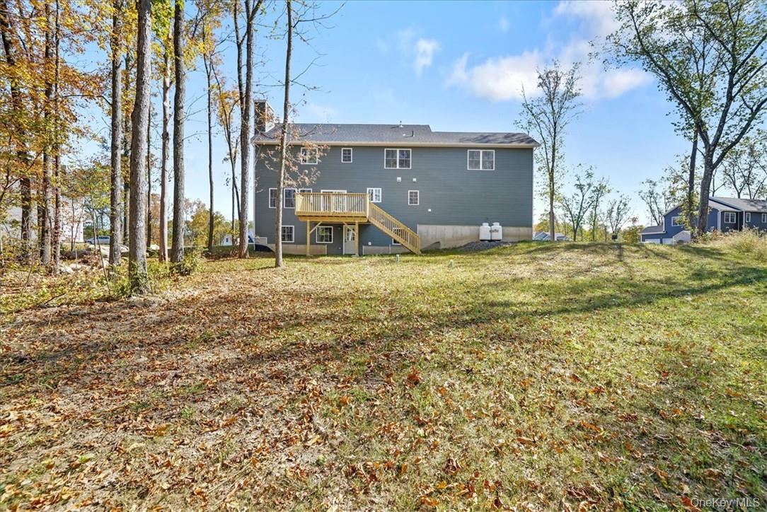 Lot 3-62 Camp Monroe Road Monroe, NY 10950 - Photo 35 of 39 Rear view of house with a yard and a wooden deck