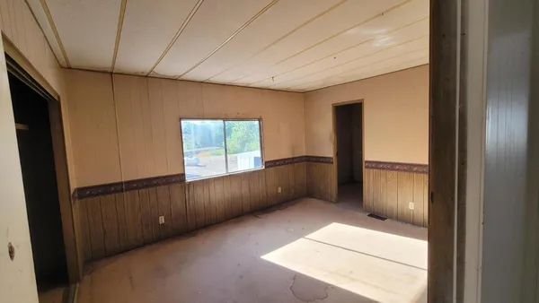 a view of an empty room with a window