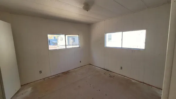an empty room with windows