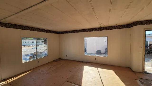 a kitchen with granite countertop a stove and a refrigerator