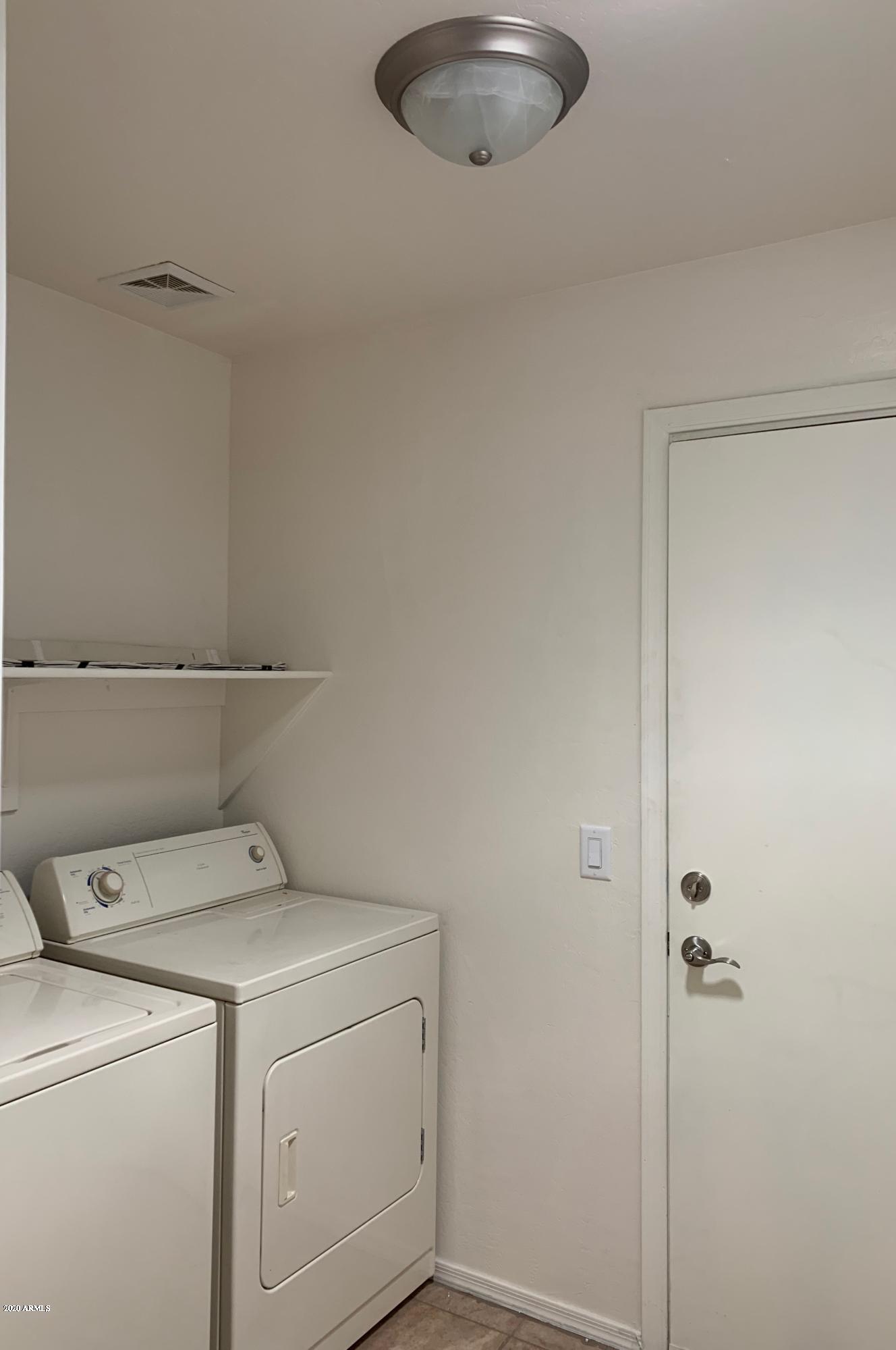 2306 West Maldonado Road Phoenix, AZ 85041 - Photo 14 of 14 a utility room with dryer and washer