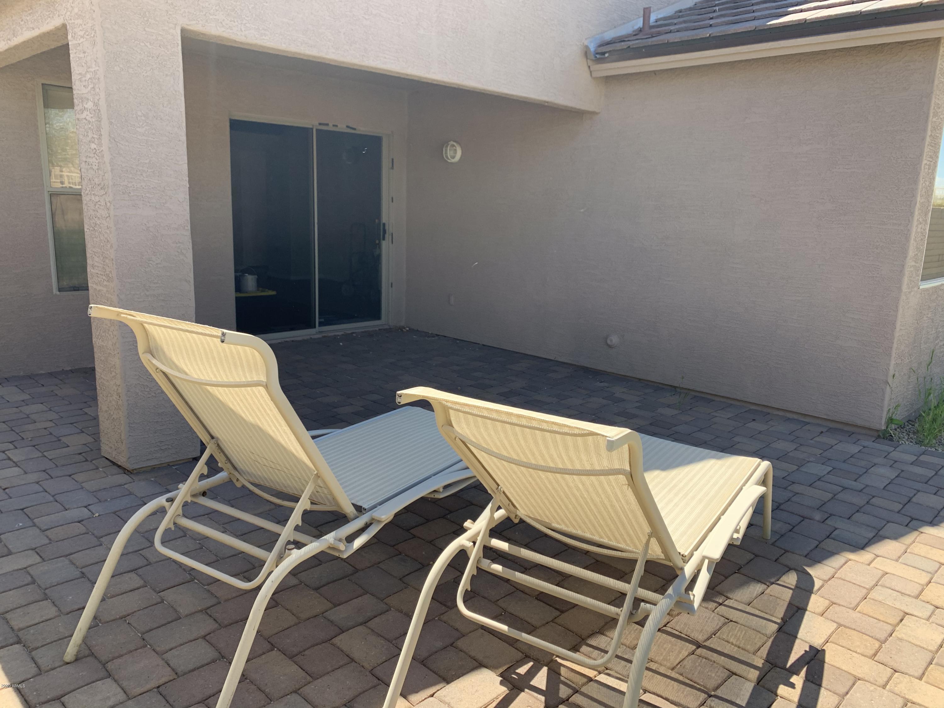 2306 West Maldonado Road Phoenix, AZ 85041 - Photo 2 of 14 a view of a room with table and chairs