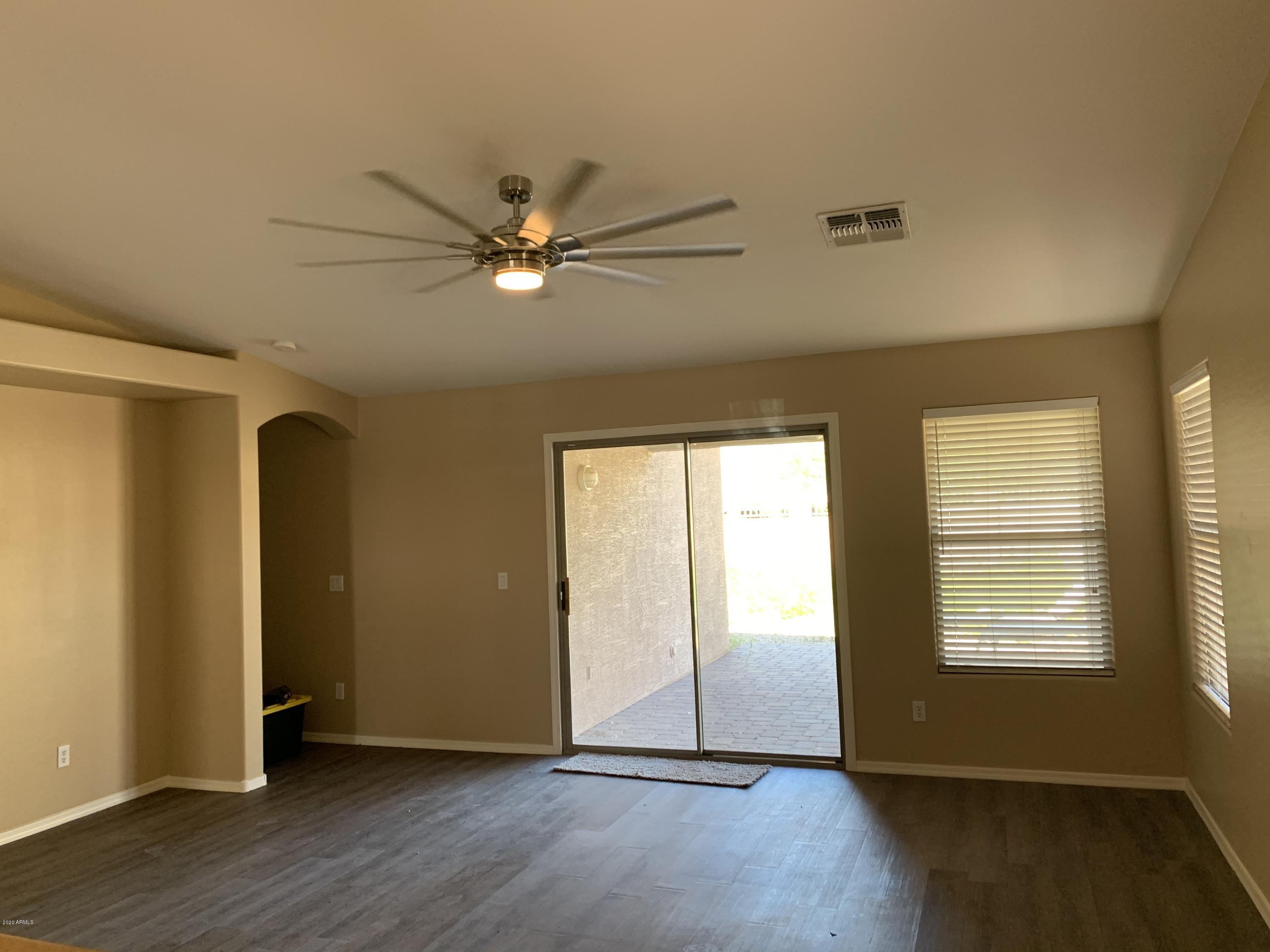 2306 West Maldonado Road Phoenix, AZ 85041 - Photo 6 of 14 a view of an empty room with a window