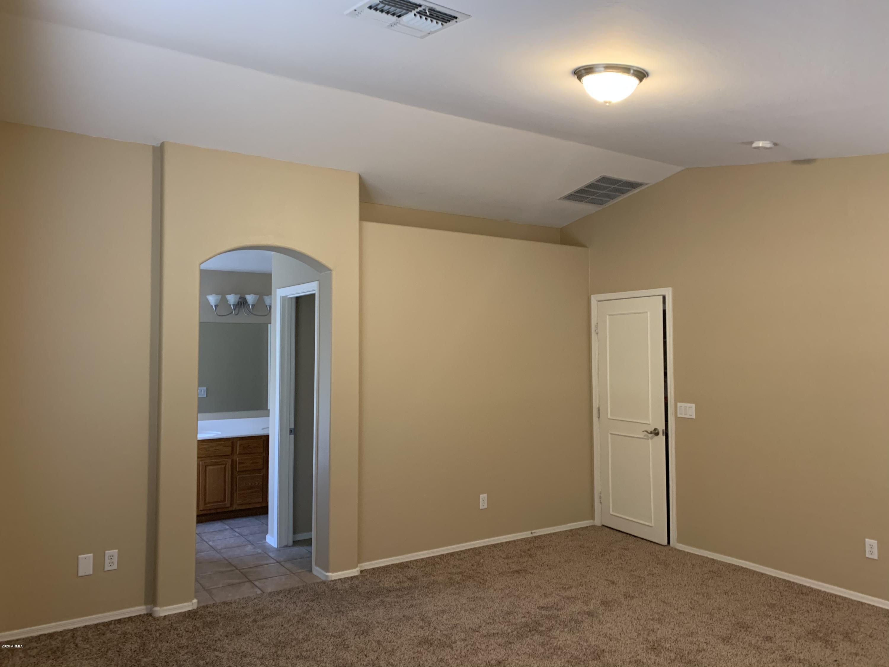 2306 West Maldonado Road Phoenix, AZ 85041 - Photo 8 of 14 an empty room with closet
