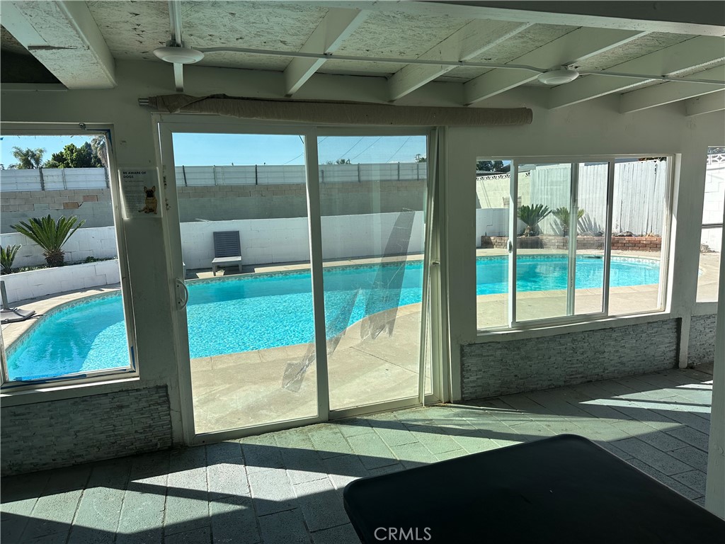 114 South Acacia Avenue Rialto, CA 92376 - Photo 16 of 27 interior sunroom overlooking outside the pool area