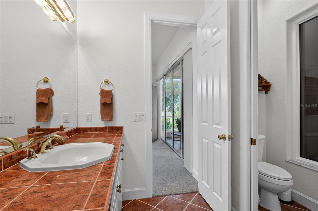 2968 Plantation Road Winter Haven, FL 33884 - Photo 35 of 81 a bathroom with a sink a toilet and shower