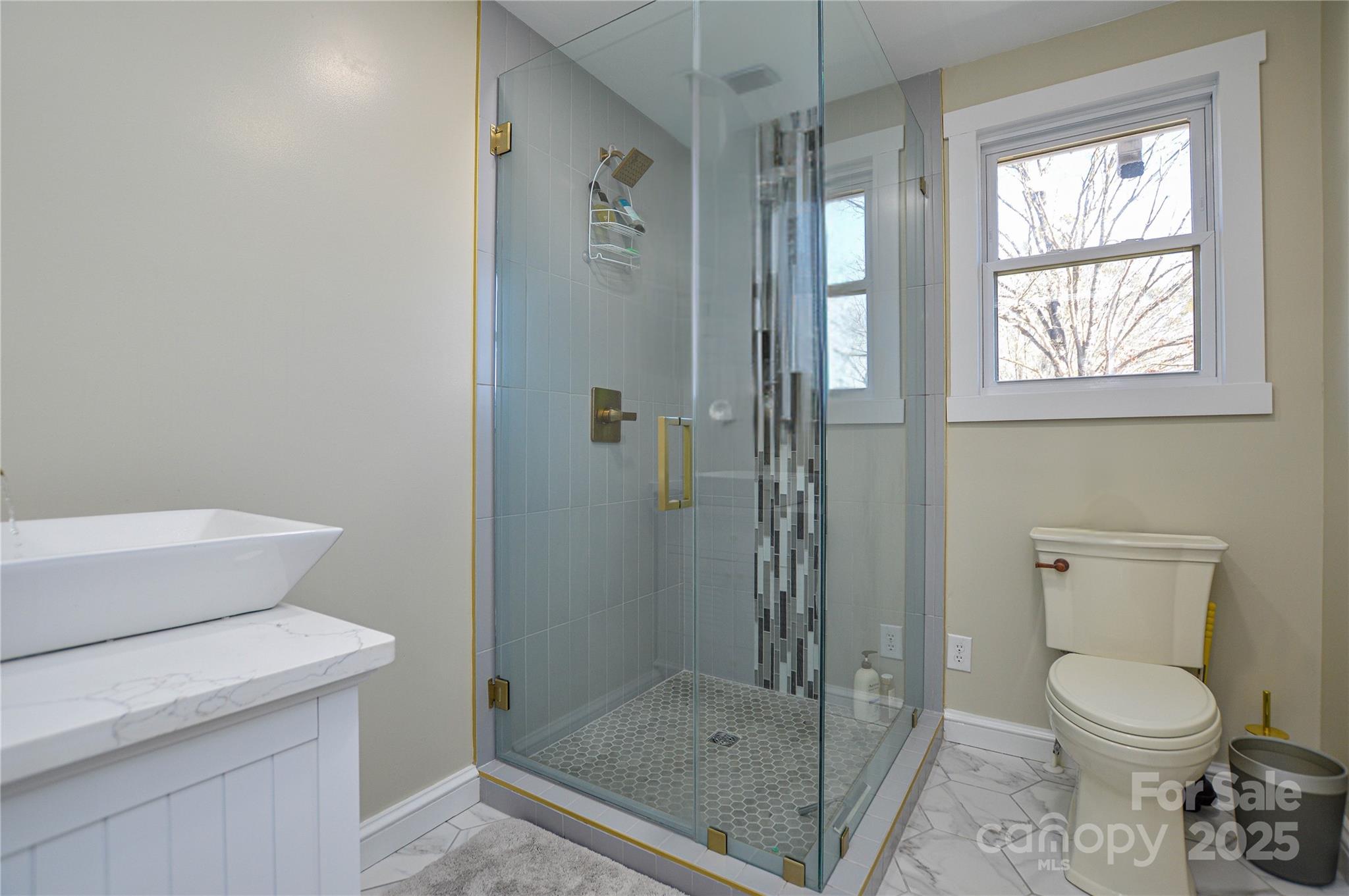 6615 Love Mill Road Monroe, NC 28110 - Photo 16 of 37 a bathroom with a toilet and a shower