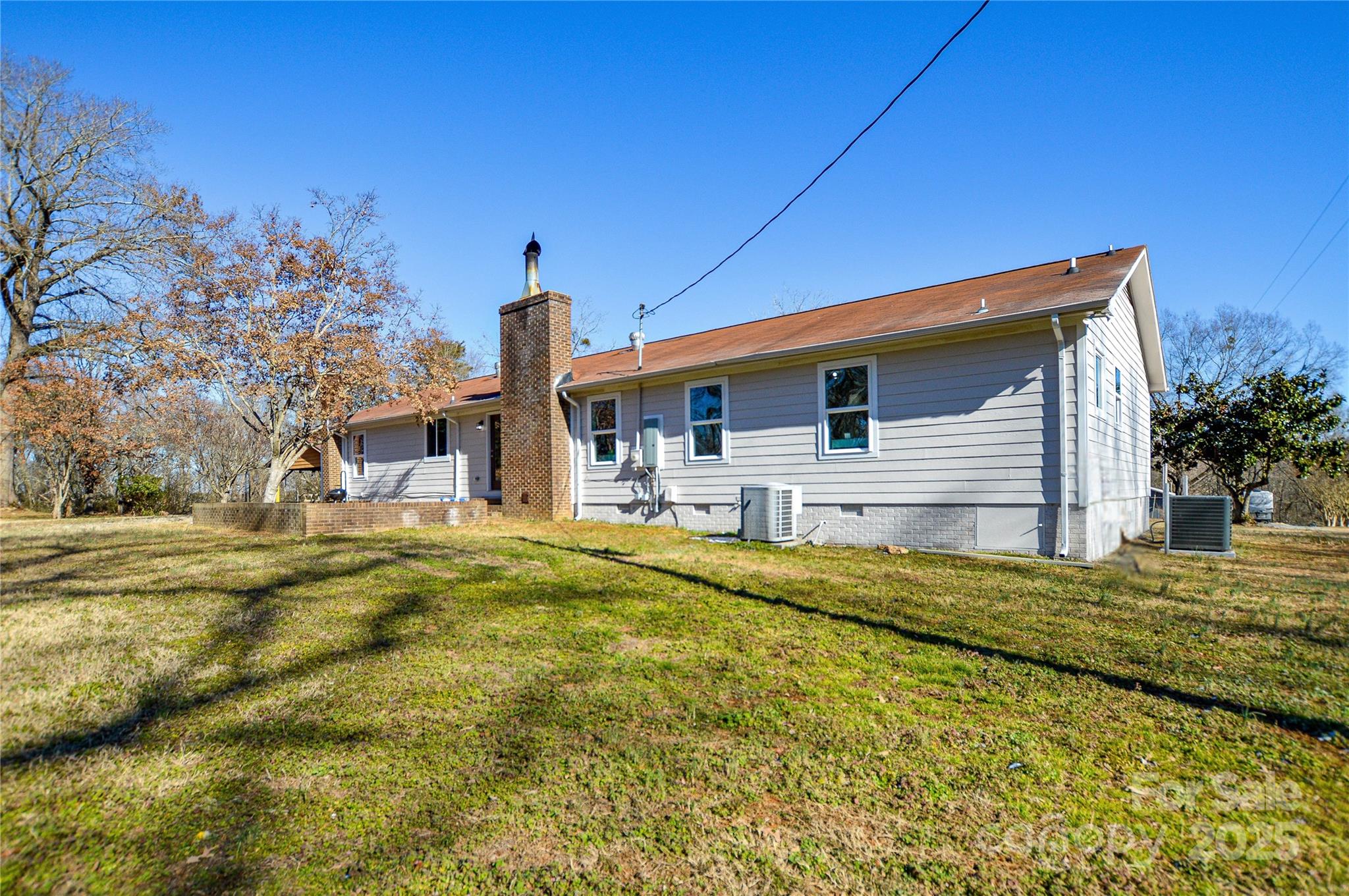 6615 Love Mill Road Monroe, NC 28110 - Photo 22 of 37 a front view of a house with a yard