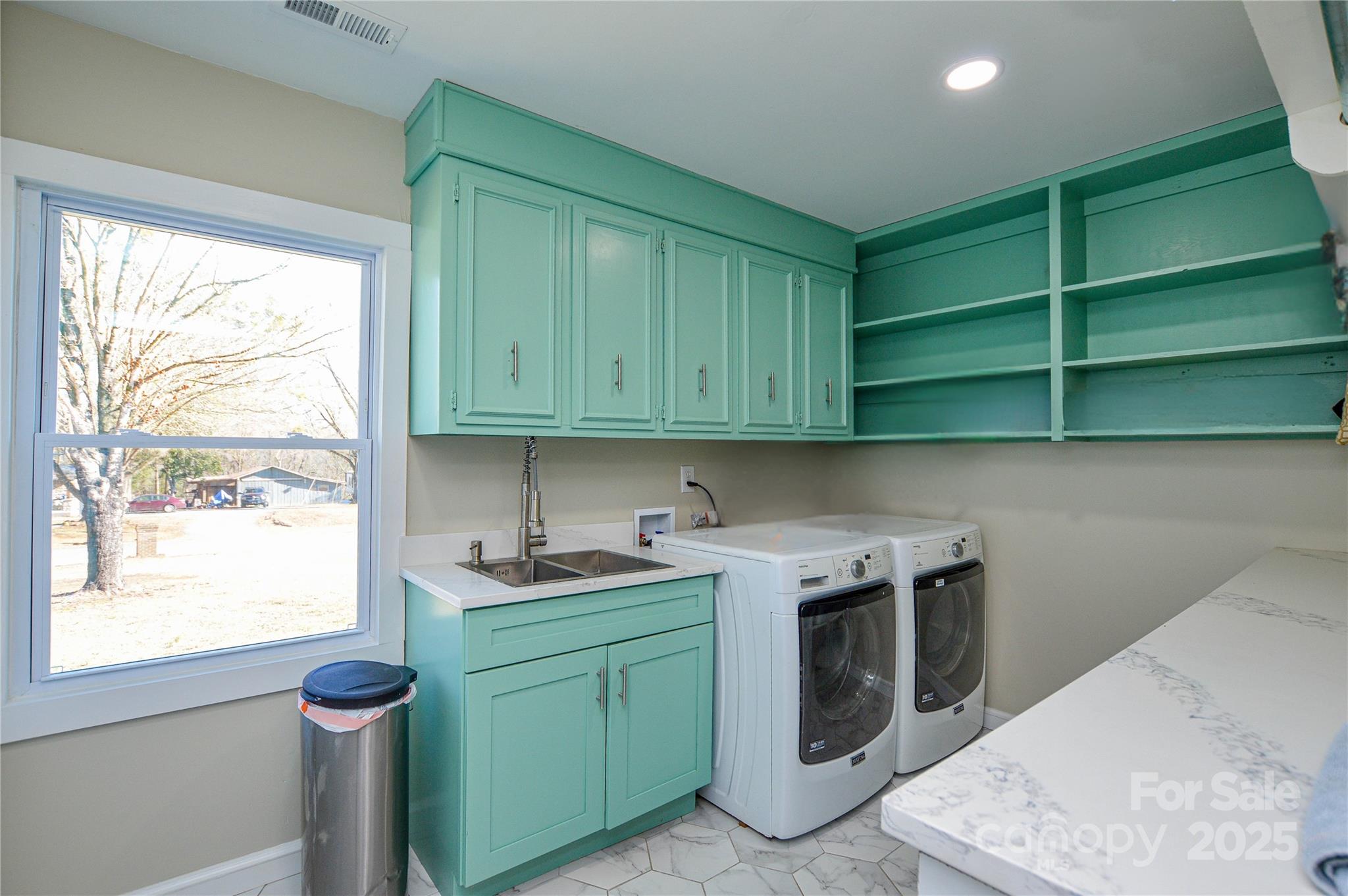 6615 Love Mill Road Monroe, NC 28110 - Photo 25 of 37 a kitchen with a sink cabinets and a window