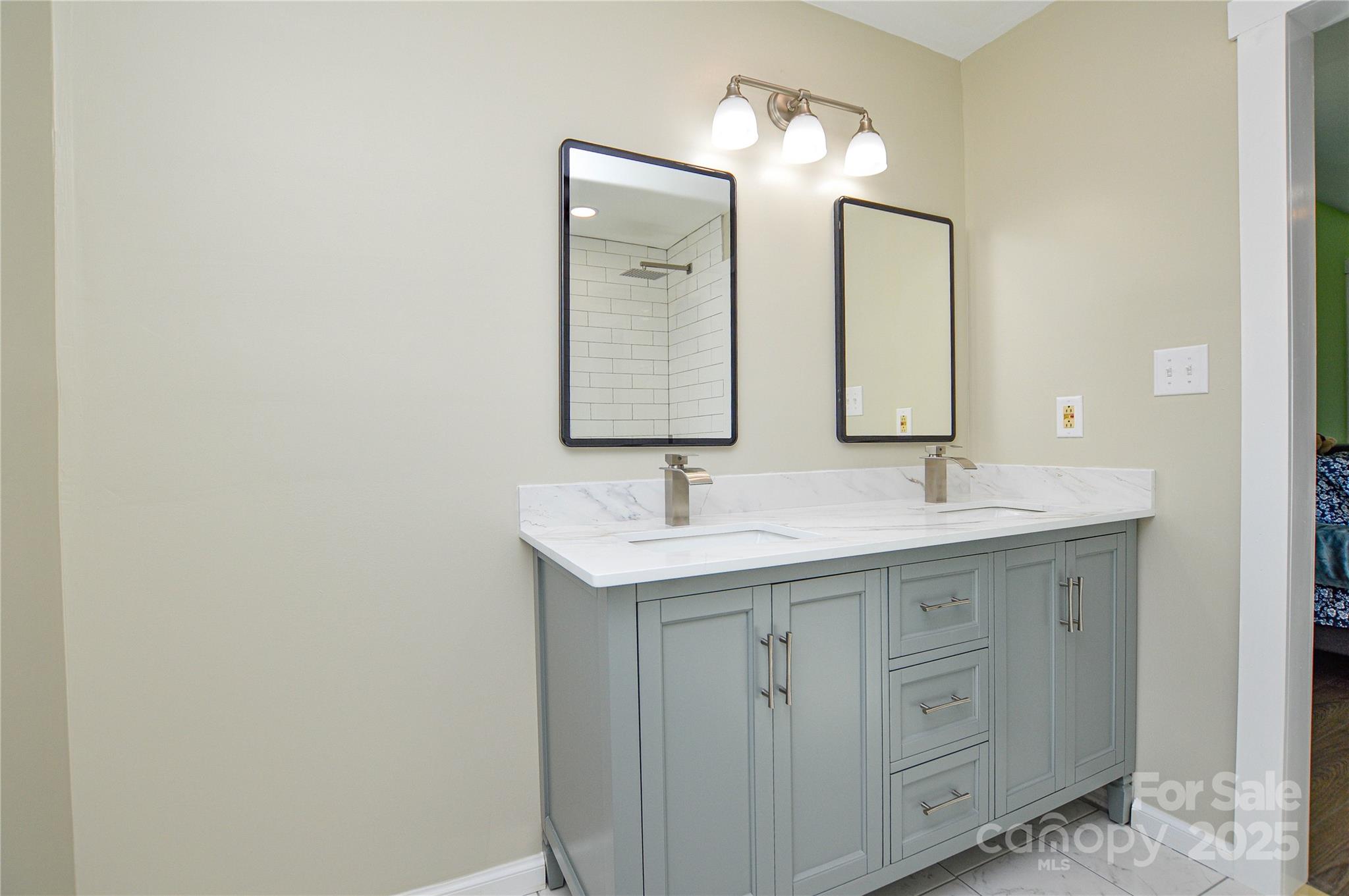 6615 Love Mill Road Monroe, NC 28110 - Photo 29 of 37 a bathroom with a sink and a mirror