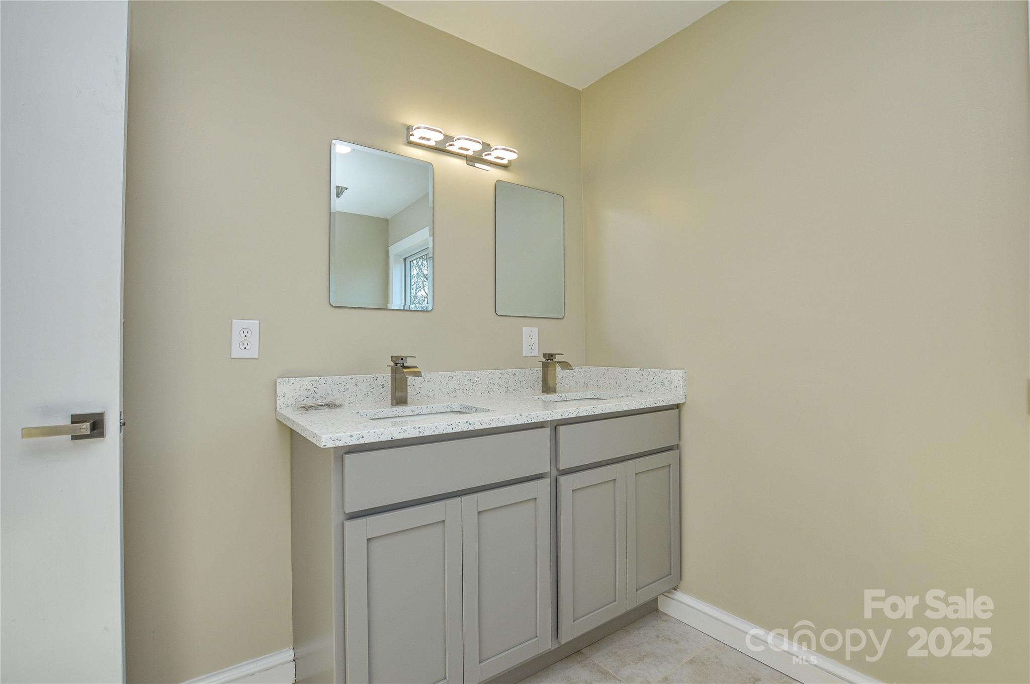 6615 Love Mill Road Monroe, NC 28110 - Photo 31 of 37 a bathroom with a sink and a mirror