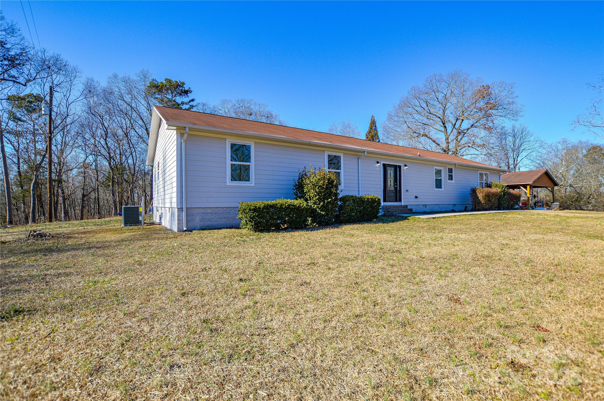 6615 Love Mill Road Monroe, NC 28110 - Photo 36 of 37 a view of a house with a yard