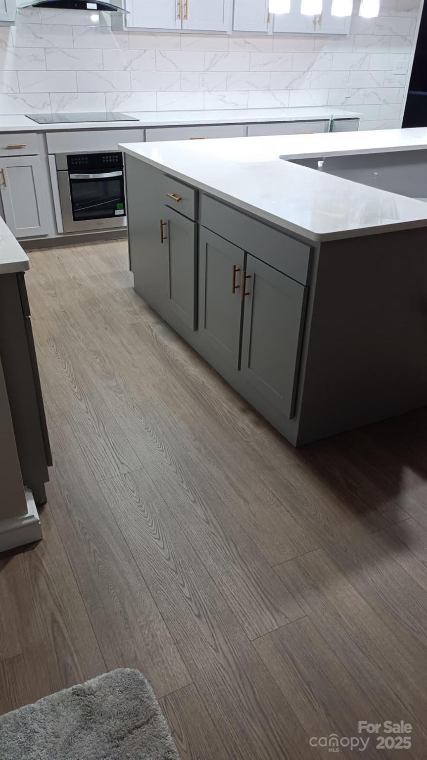 6615 Love Mill Road Monroe, NC 28110 - Photo 8 of 37 a kitchen with stainless steel appliances a sink and cabinets
