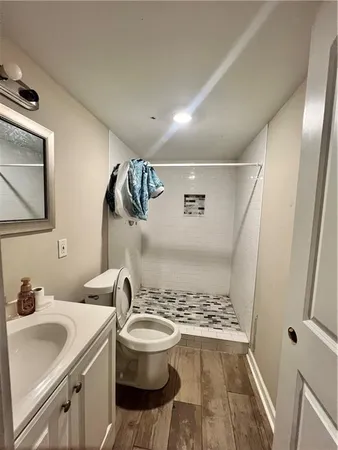 a view of a bathroom with a sink and mirror