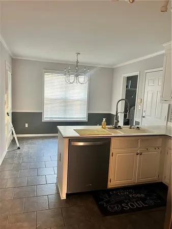 a view with granite countertop a sink and a window