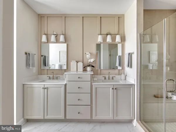 a living room with kitchen island furniture and a chandelier