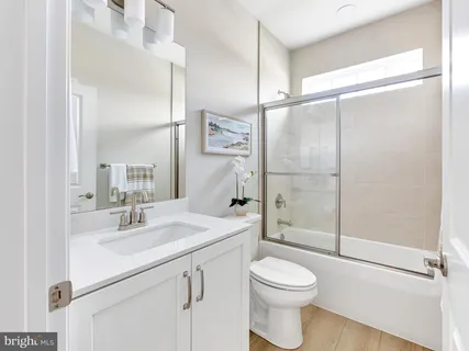 a kitchen with a sink cabinets and appliances