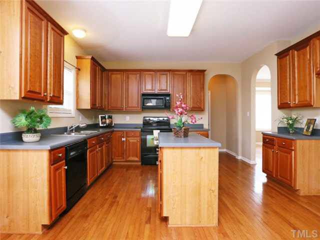 8608 Churchdown Court Raleigh, NC 27613 - Photo 9 of 25 View of the kitchen looking from the family room. This kitchen has a great walk in pantry. Kitchen