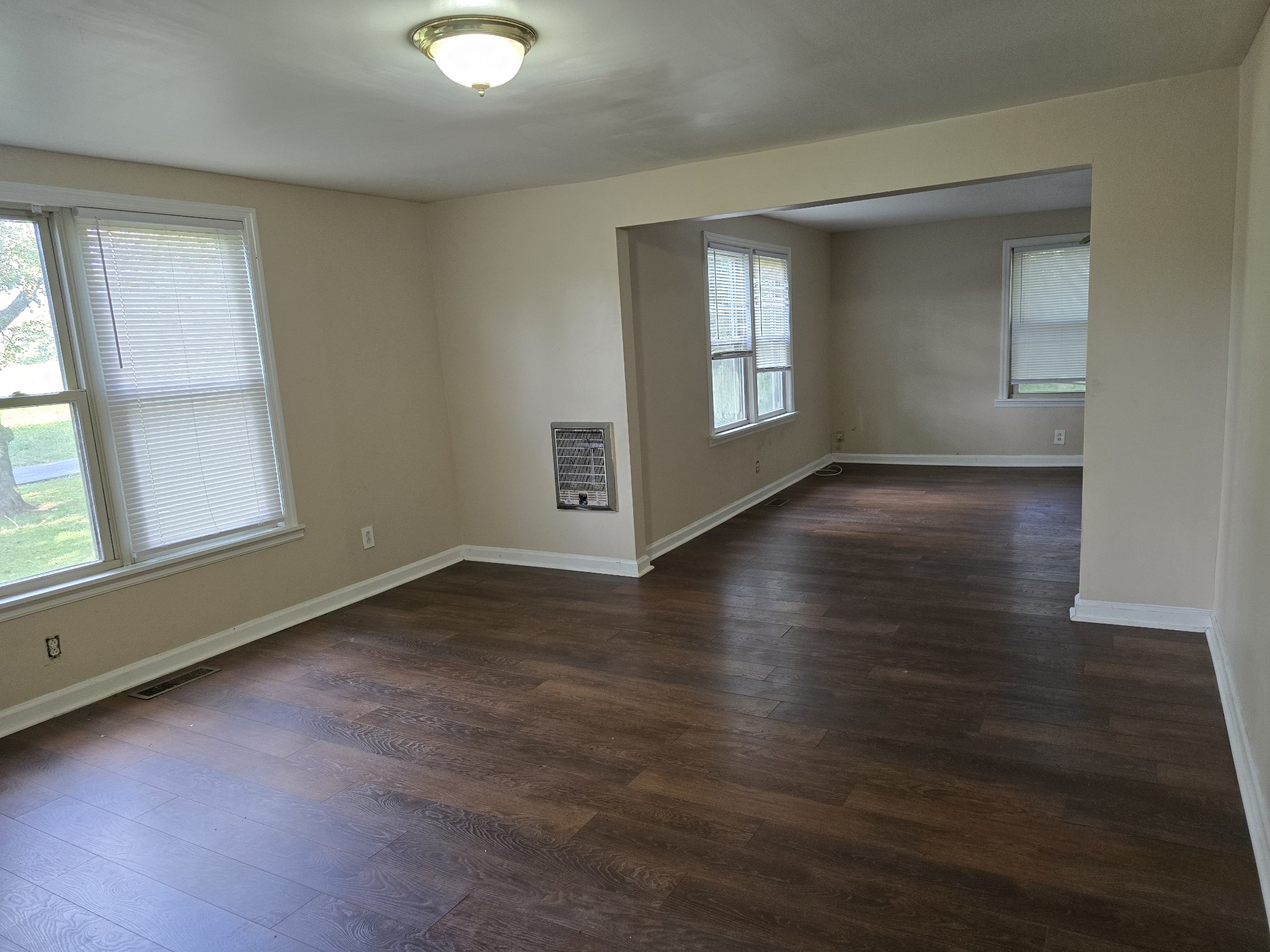 2606 Cave Springs Road Springfield, TN 37172 - Photo 13 of 27 an empty room with wooden floor and windows
