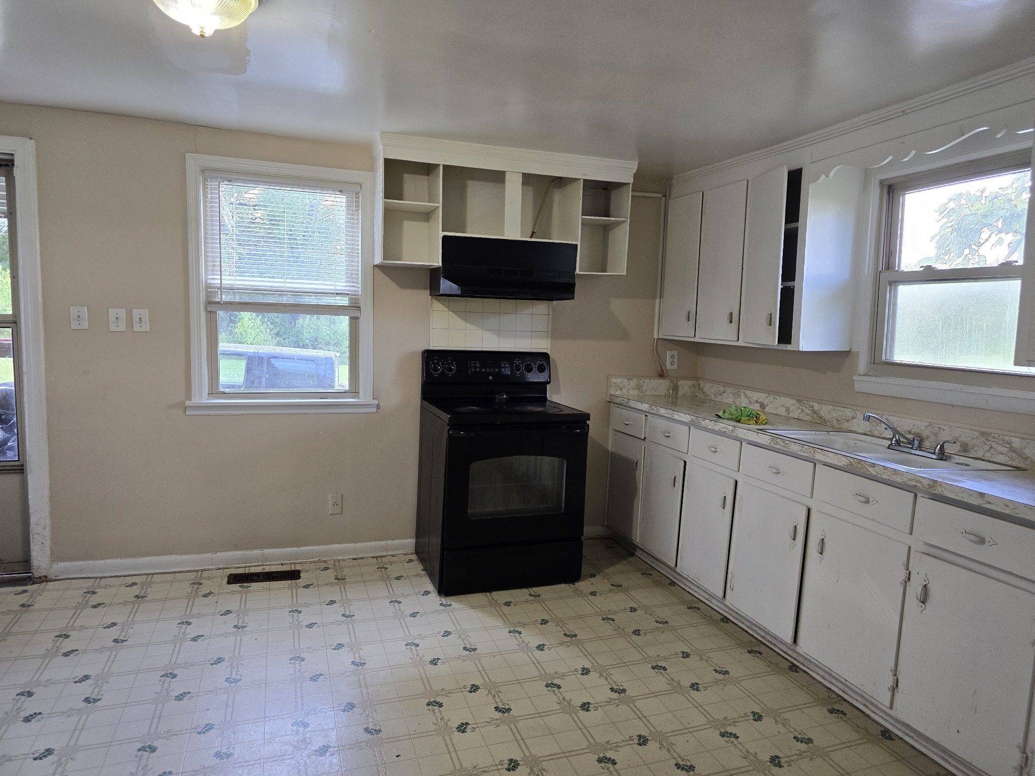 2606 Cave Springs Road Springfield, TN 37172 - Photo 15 of 27 a kitchen with a stove a sink and a microwave