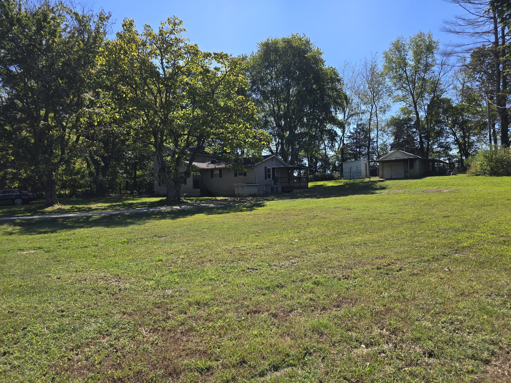 2606 Cave Springs Road Springfield, TN 37172 - Photo 22 of 27 a view of a field with trees in the background