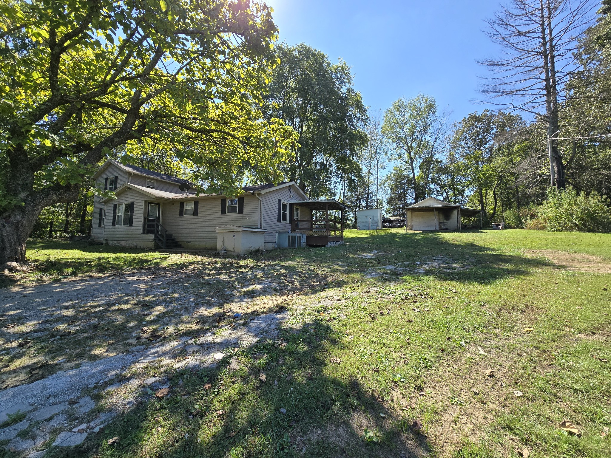 2606 Cave Springs Road Springfield, TN 37172 - Photo 23 of 27 a view of a yard with plants and a tree
