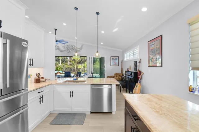 a bedroom with a large bed and a couch