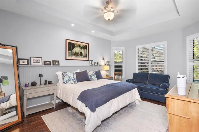 a living room with furniture and a book shelf
