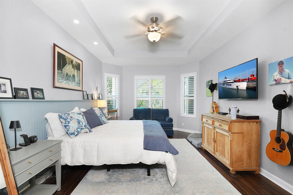 6848 Southeast Twin Oaks Circle Stuart, FL 34997 - Photo 21 of 70 a living room with furniture and a flat screen tv