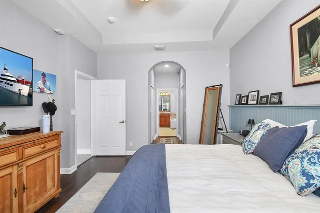 a spacious bathroom with a granite countertop tub sink and mirror