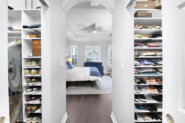 a spacious bathroom with a tub sink and mirror