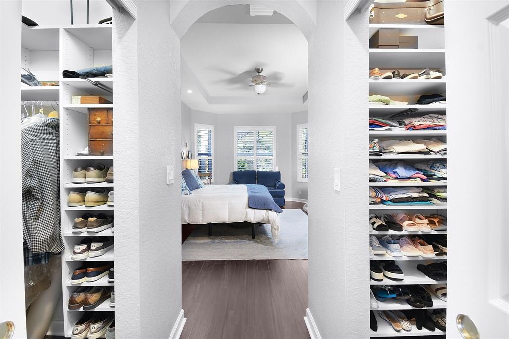 6848 Southeast Twin Oaks Circle Stuart, FL 34997 - Photo 23 of 70 a living room with furniture and a book shelf