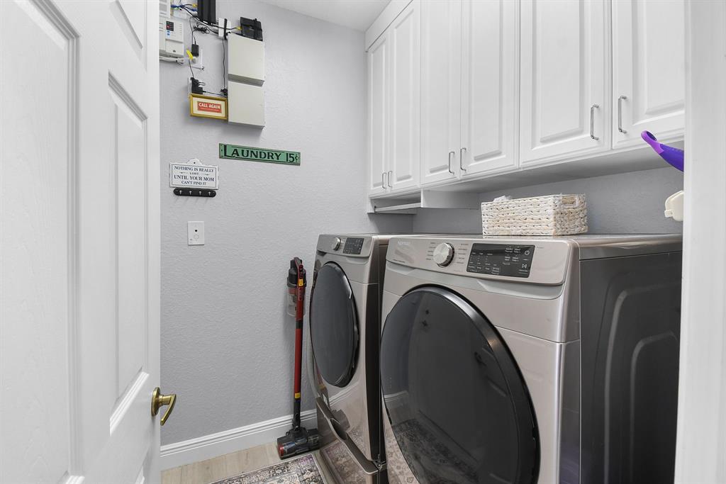 6848 Southeast Twin Oaks Circle Stuart, FL 34997 - Photo 33 of 70 LAUNDRY AND GARAGE ACCESS