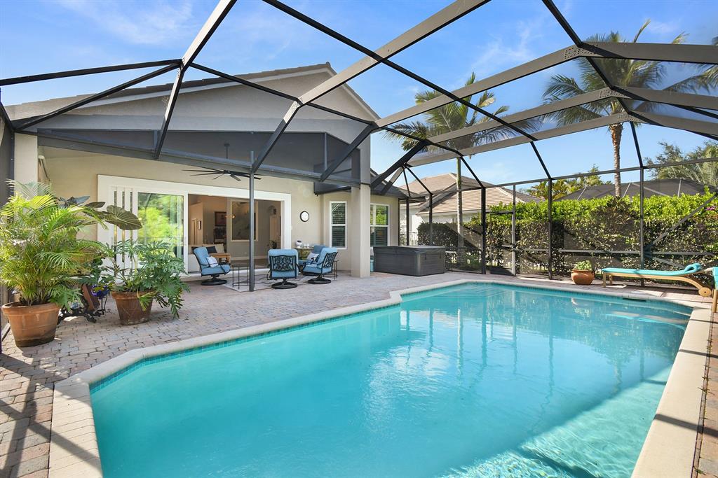 6848 Southeast Twin Oaks Circle Stuart, FL 34997 - Photo 38 of 70 a view of a swimming pool with a patio