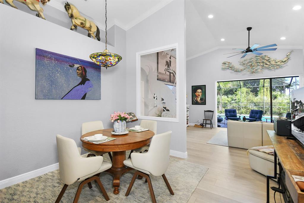 6848 Southeast Twin Oaks Circle Stuart, FL 34997 - Photo 5 of 70 a living room with furniture and a window