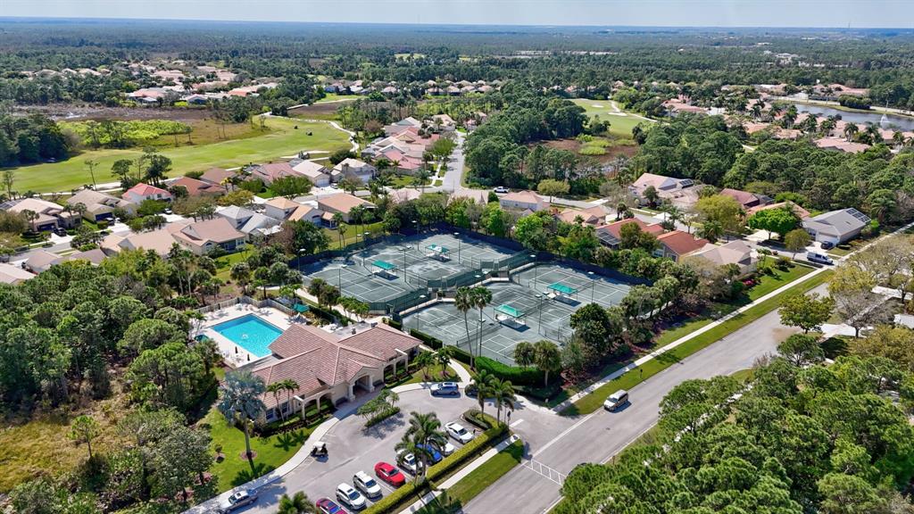 6848 Southeast Twin Oaks Circle Stuart, FL 34997 - Photo 70 of 70 an aerial view of a city with lots of residential buildings