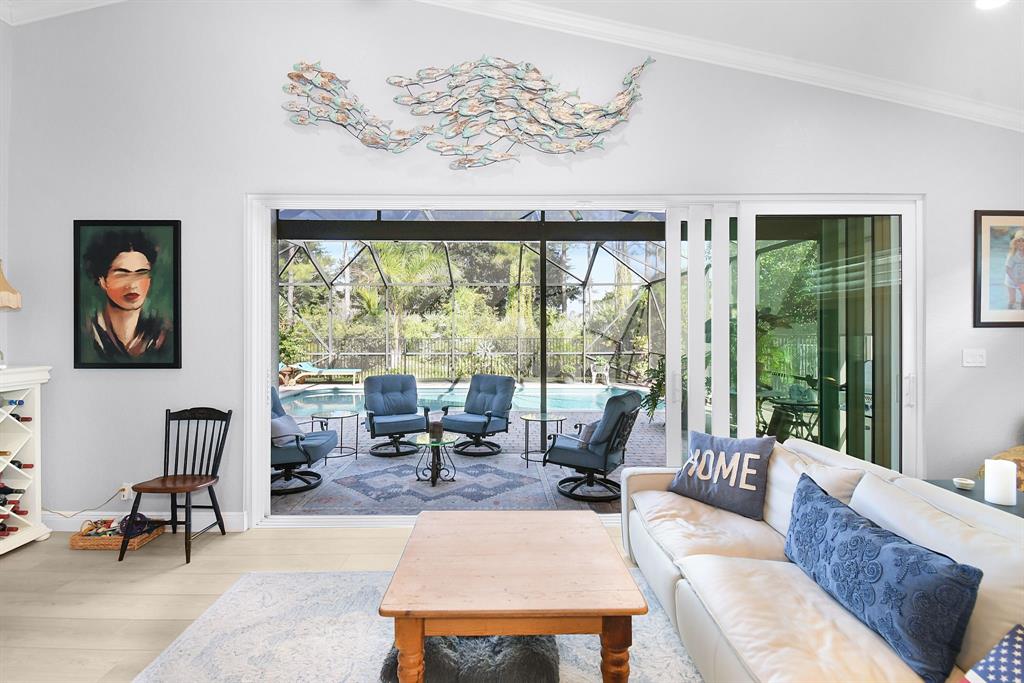 6848 Southeast Twin Oaks Circle Stuart, FL 34997 - Photo 8 of 70 a living room with furniture and a large window