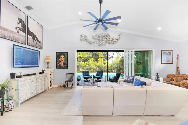 a living room with fireplace furniture and a wooden floor