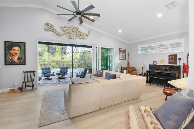 a living room with fireplace furniture and a wooden floor