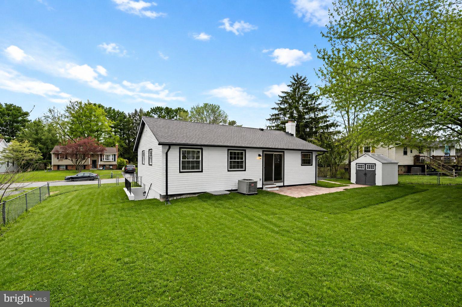 24320 Log House Road Gaithersburg, MD 20882 - Photo 38 of 43 a front view of house with yard and green space
