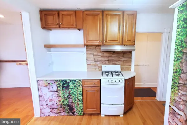 a view of kitchen with wooden floor