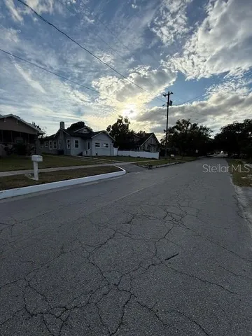 a view of an outdoor space and tennis court