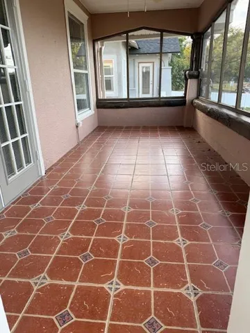 a view of empty room with windows