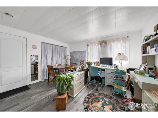 a view of a workspace with furniture and a livingroom