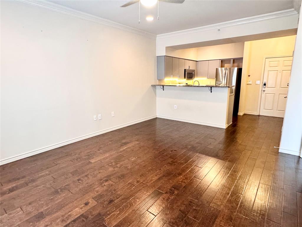a view of a kitchen with a sink and a window