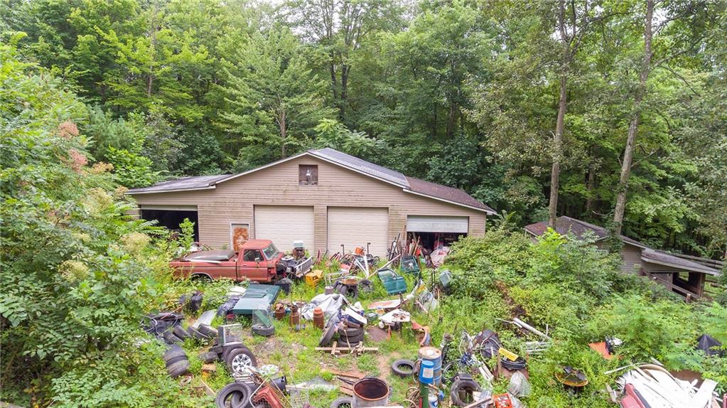 154 Sutherland Road Jeannette, PA 15644 - Photo 22 of 25 a view of a house with a yard and potted plants