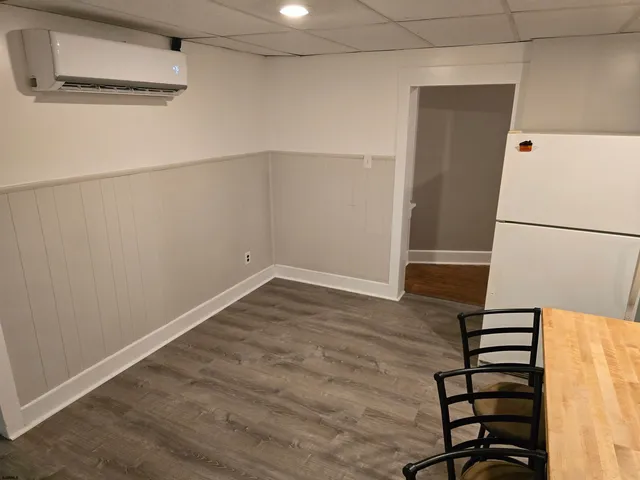 a view of entryway with wooden floor