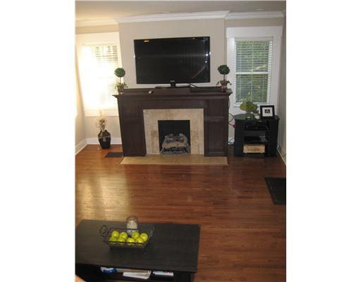 1002 Delafield Road Fox Chapel, PA 15215 - Photo 8 of 18 Living Room. Large living room with hardwood floors, gas log fireplace/mantle. Flows through to dining/kitchen area.